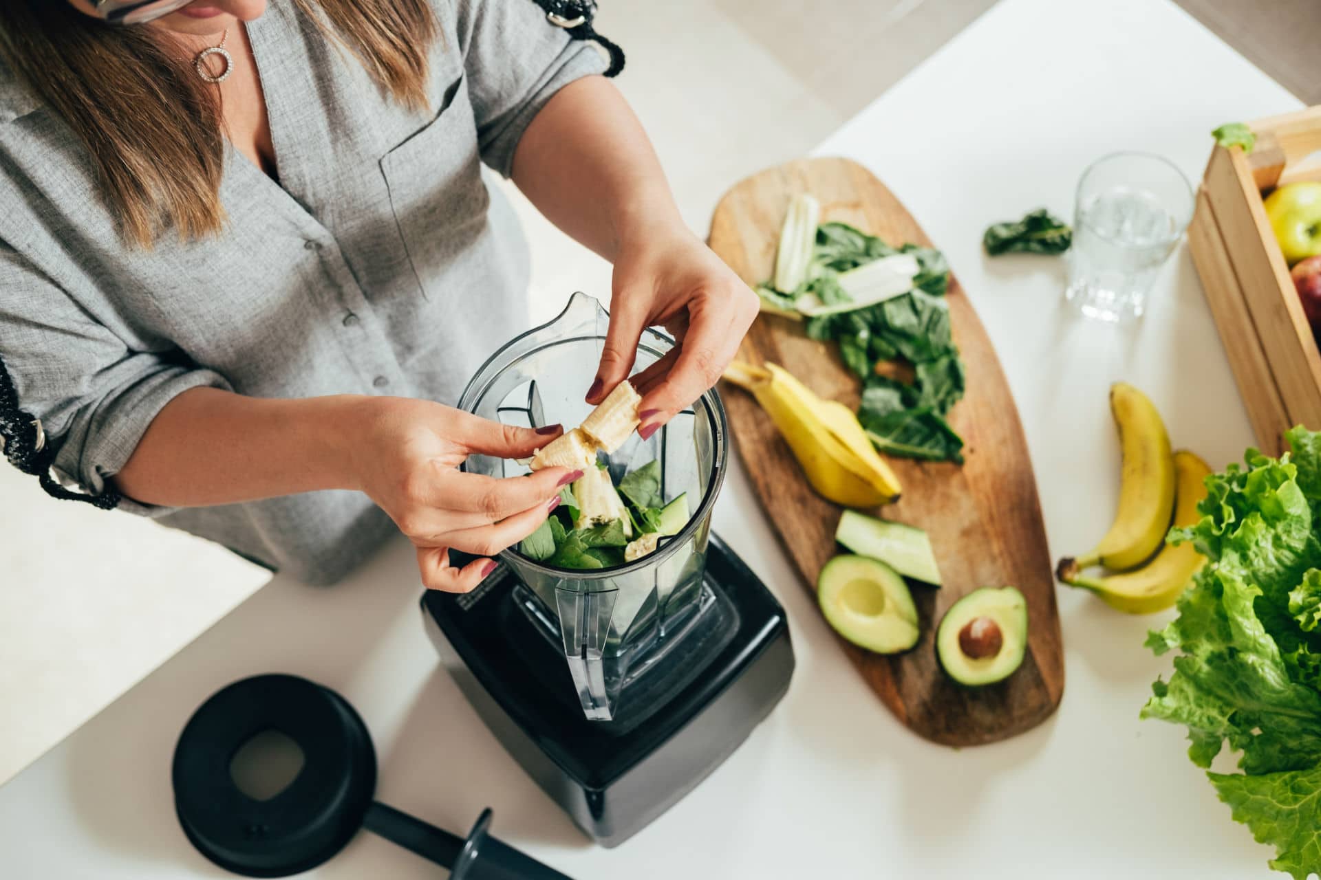 CBD oil with smoothies woman preparing smoothie
